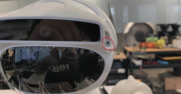 Two screws on the camera pan mount highlighted in red circle