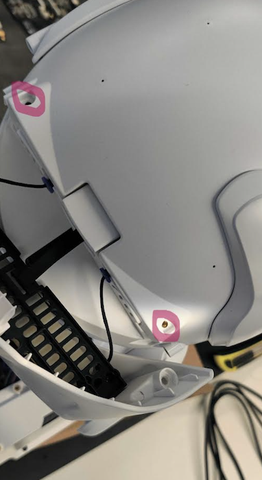 Two screws on top of Misty's head highlighted with circles