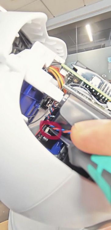 Front connector hidden behind cables near the pan mount holder