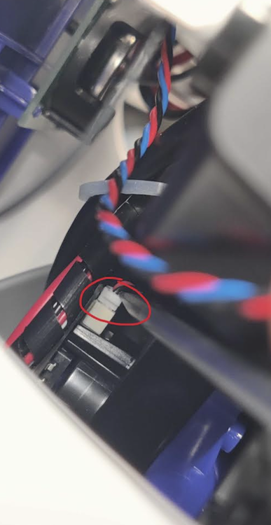 Pressing the front connector back in with the flat head screwdriver